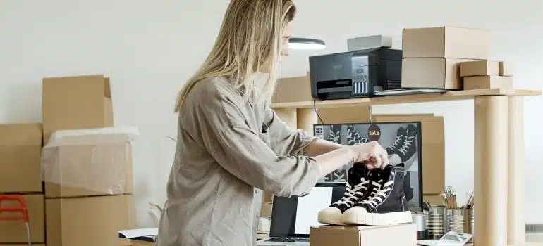 Woman packing black shoes