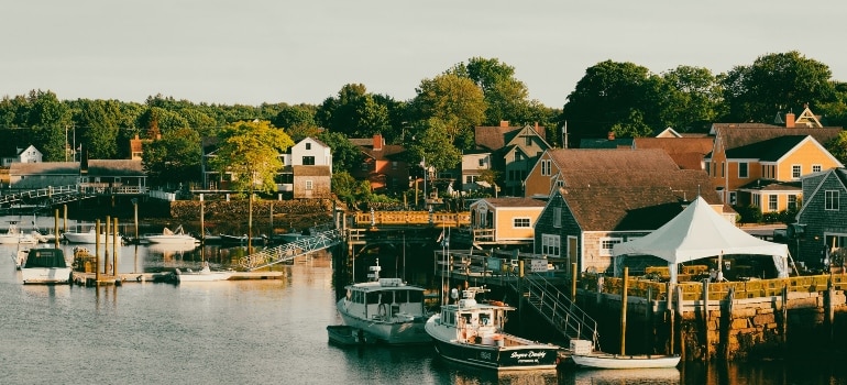 Portsmouth is one of the ideal places for family time in New Hampshire, with boats on the water, picturesque houses, and greenery. 