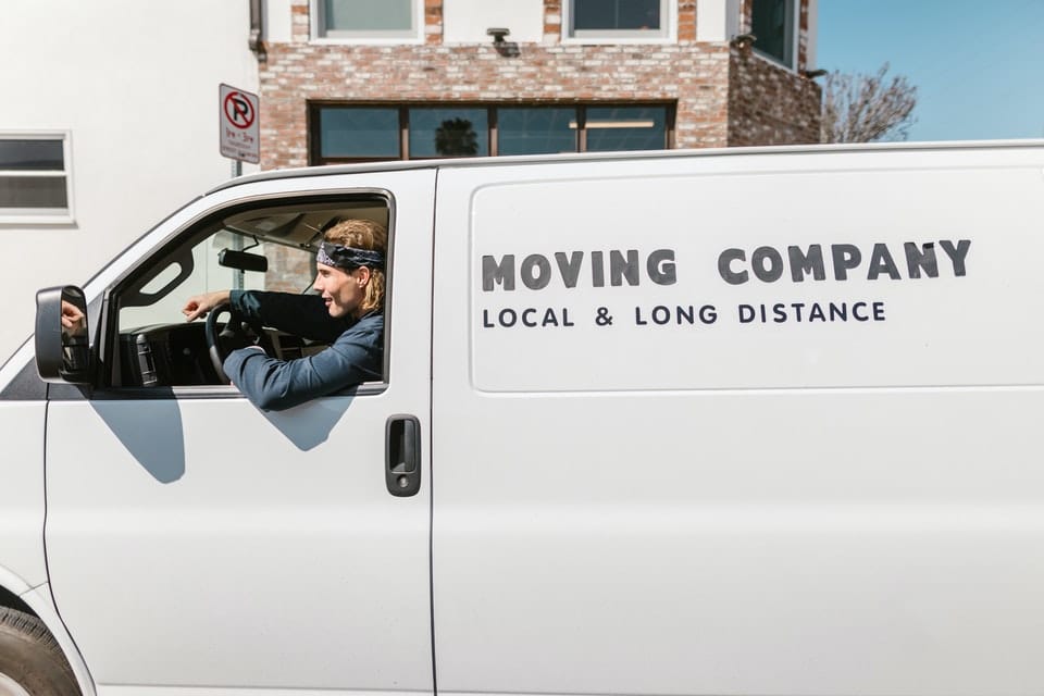 A mover driving a moving company truck