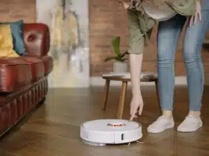 A woman and a robot cleaner