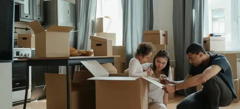 a family playing with cardboard boxes