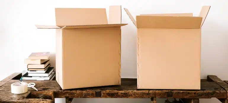 two moving boxes on the desk as an example of packing material you should be using to move and store outdoor furniture
