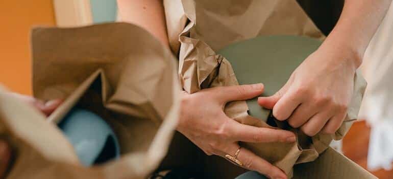 A person packing dishes