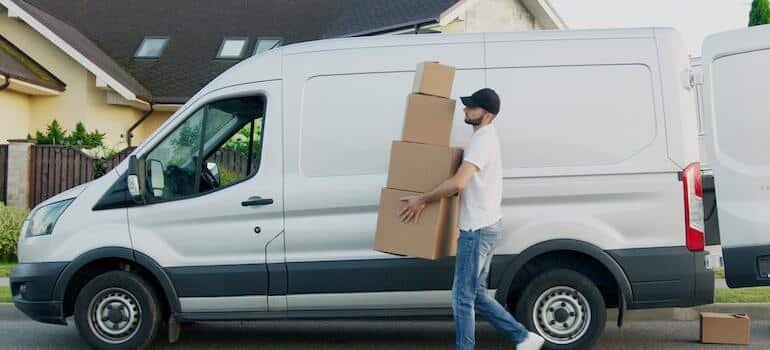 A mover unloading a van